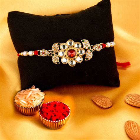 Sukkhi Glorious Gold Plated Floral Rakhi Combo (Set of 2) with Roli Ch ...