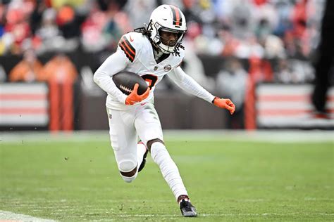 Cleveland Browns player running with the football during a game.