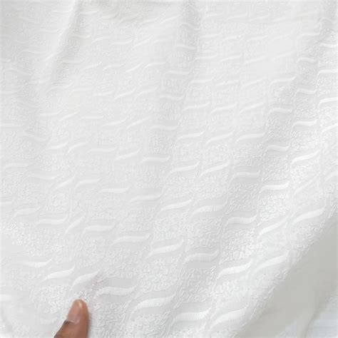 White Chikankari Cotton Fabric with Wavy Design – Matching Woman