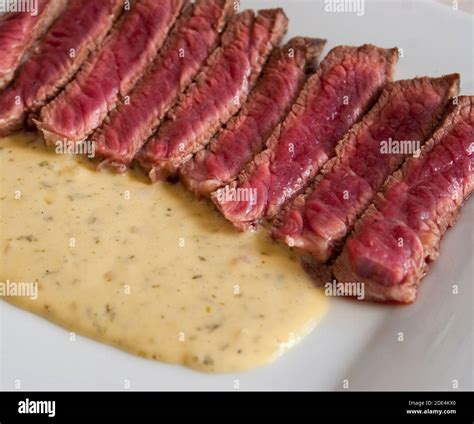 Grilled Sirloin Steak with Sauce Bearnaise Stock Photo - Alamy
