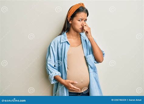 Beautiful Hispanic Woman Expecting a Baby, Touching Pregnant Belly ...