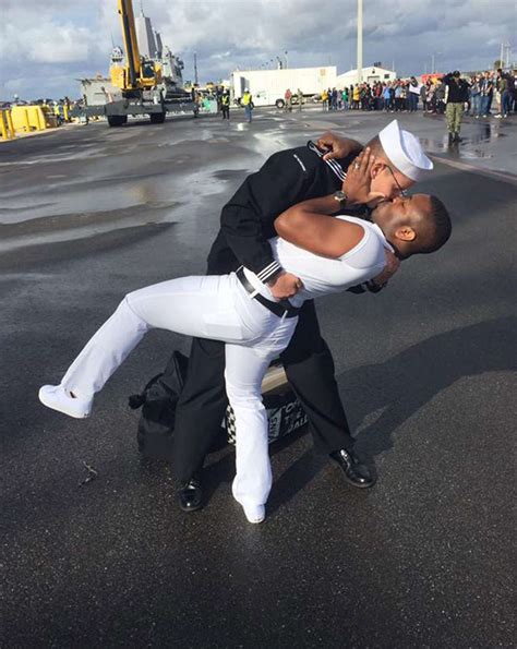 Gay Navy Sailor's Homecoming Kiss with Husband Sets Off Outrage