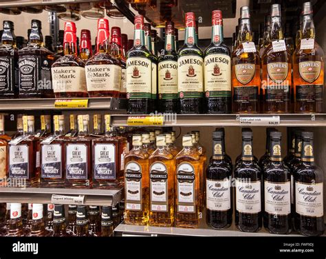 bottles of alcohol on the shelves of a liquor store Stock Photo - Alamy