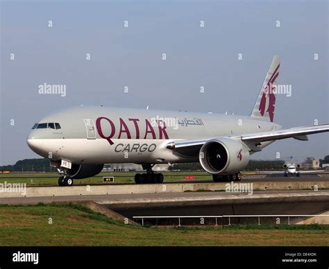 A7-BFE is a Qatar Airways Cargo Boeing 777-FDZ, shown landing at an airport. This freighter ...