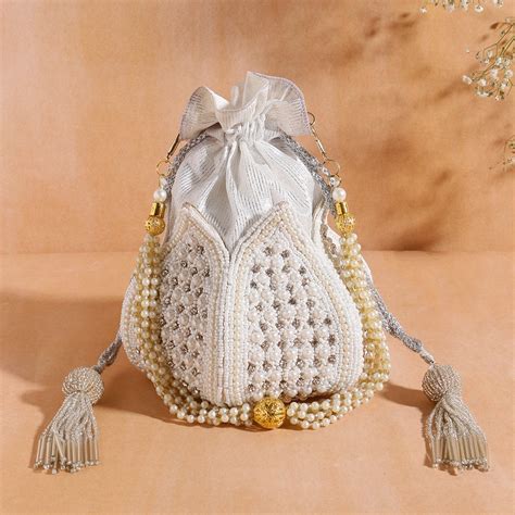 Elegant Flower Design Embellishment Potli – Swisni