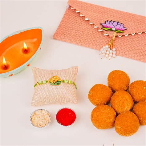 Send Auspicious Ganesha Rakhi & Besan Laddu Online
