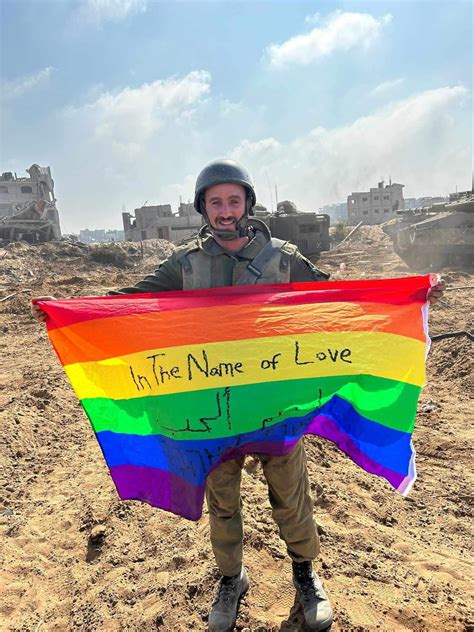 Gay Israeli soldier Yoav Atzmoni proudly displays LGBTQ flag on Gaza ...