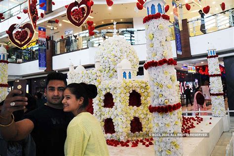 A couple in a decorated shopping mall on the eve of Valentine's day in ...
