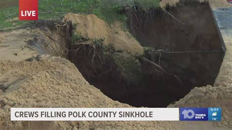 Crews start filling 60-foot sinkhole in Polk County yard | wtsp.com