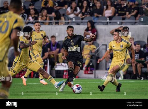 LAFC forward Denis Bouanga (99) sends a pass between Real Salt Lake ...