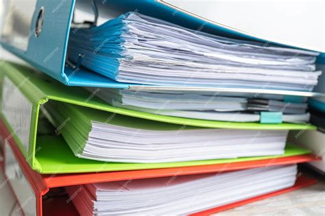 File folder binder stack of multi color on table in business office ...