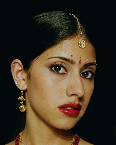A bindi is a forehead decoration Indians wear. The red dots and the ...