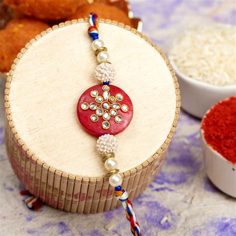 Handmade Beaded Pearl Red Kundan Rakhi with Roli Chawal - Lookandadorn.com