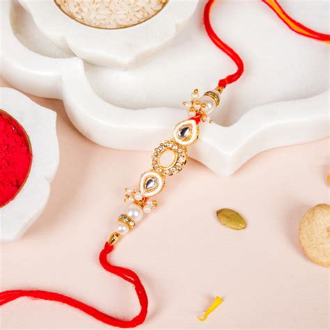 Stone And Pearl White Kundan Rakhi Set For Couple Online - Premium Gift ...