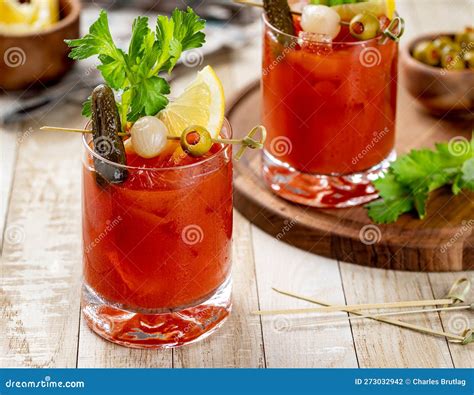 Bloody Mary Cocktail with Garnishes on Wooden Table Stock Photo - Image ...