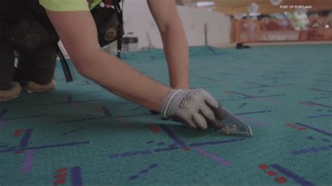 Iconic PDX carpet rolled out in main terminal | kgw.com