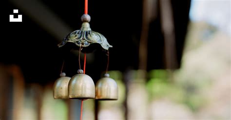 Image shows bell about three metres high, with celebrant alongside