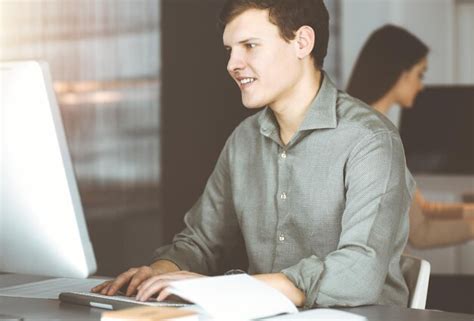 Man at Computer Desk 的图像结果