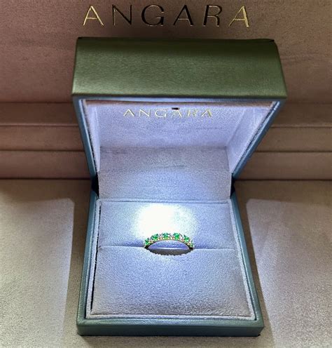 Shared Prong Emerald and Diamond Half Eternity Ring | Angara