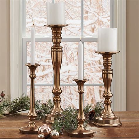 Gold Gena Pillar Holder | Tall pillar candle holder, Gold pillar ...
