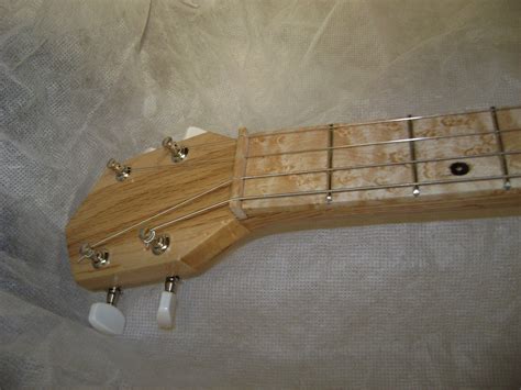 4 String Cigar Box Guitar Lessons 的图像结果