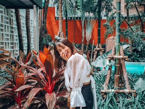 Woman standing by plants | Premium Photo