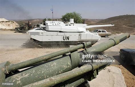 FILE PHOTO: United Nations peacekeepers (UNIFIL) and Lebanese army soldiers stand guard at a checkpoint in Naqoura, near the Lebanese-Israeli border, southern Lebanon, October 27, 2022. REUTERS/Aziz Taher/File Photo