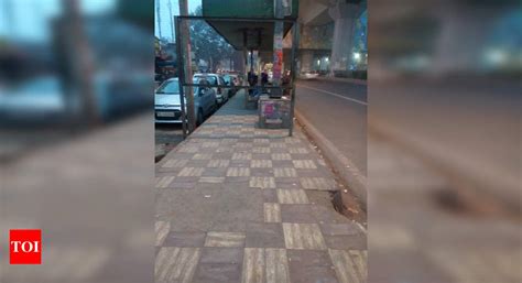 Footpath blocked by iron board - Times of India
