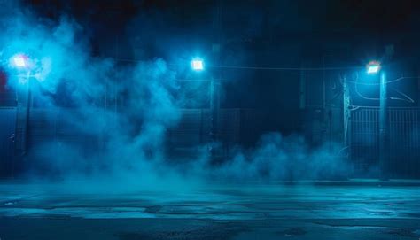 Eerie alleyway shrouded in a mysterious blue fog at night | Premium Photo