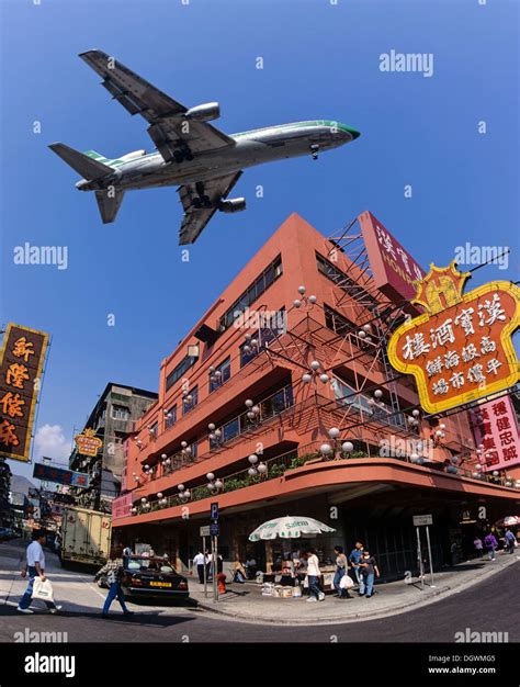 Cathay Pacific aircraft approaching Kai Tak Airport over the rooftops ...
