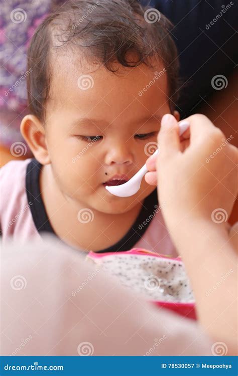 Asian Baby Eating a Dragon Fruit with Happily. Stock Image - Image of eating, health: 78530057