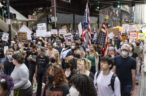 Car plows through Chicago protest as thousands rally in solidarity with ...