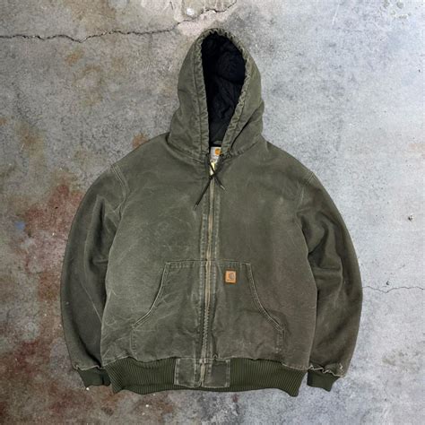 Green Carhartt jacket with unique fading and... | Depop