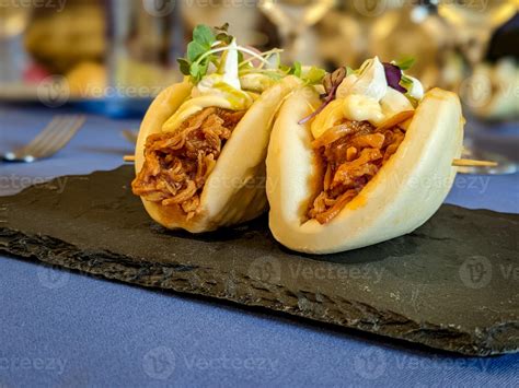 Fusion of asian and spanish food, bao bread with shredded meat 19825232 ...