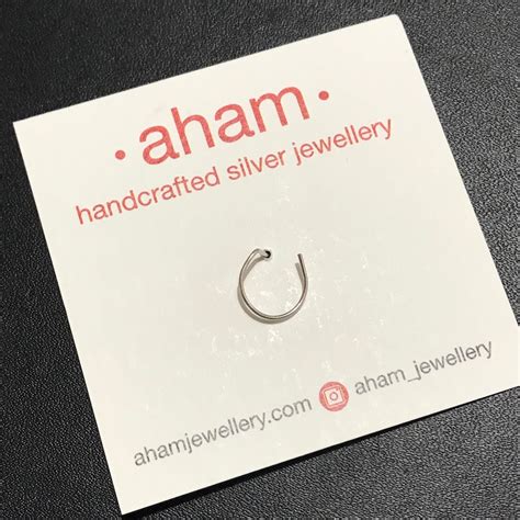 Silver Wire Wind-mill Nosepin with Black Meena – aham jewellery ...