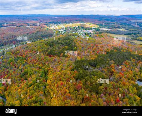 An aerial view of Thomas, West Virginia among the mountains and fall ...