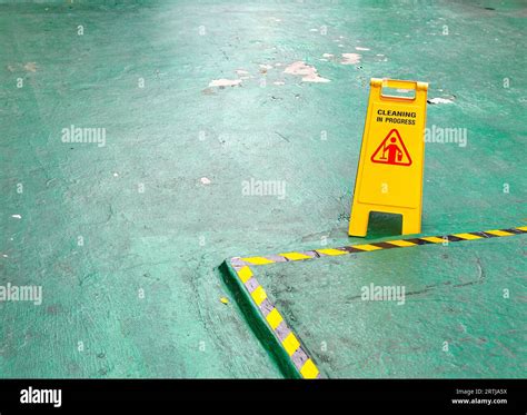 Sign showing warning of caution wet floor, Yellow sign that alerts for ...