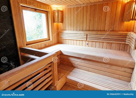 Wooden Benches in the Sauna with Lamps in the Corners Near the Window ...