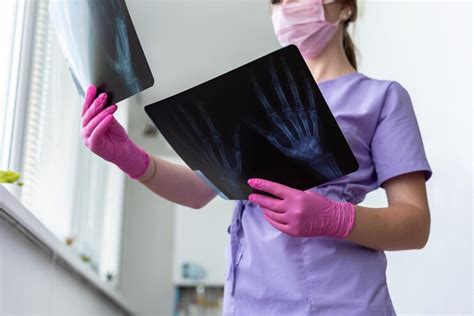 Image of a doctor and a patient reviewing a scan.