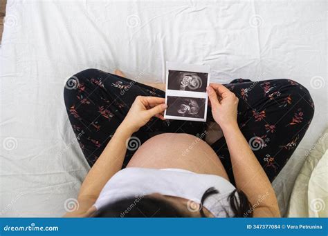 Pregnant Woman Holding Ultrasound Images Stock Photo - Image of bedroom ...