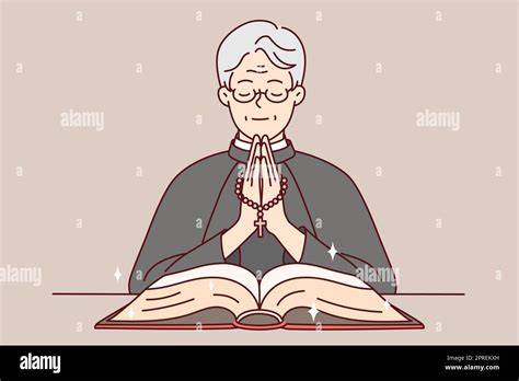 Calm priest in robe holding rosary praying with bible in church. Happy ...
