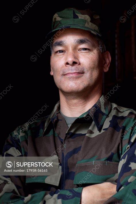 Portrait of mature man wearing military uniform - SuperStock