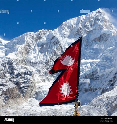 Flag of Nepal in Himalayas with snowy mountain background on Everest ...