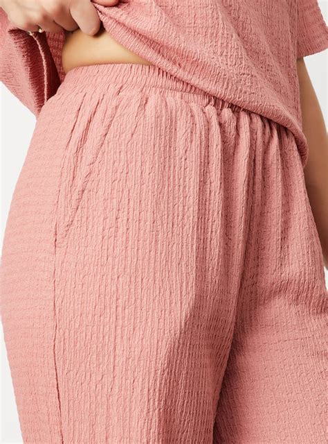 Buy Women Textured Wide-Leg Trousers Online at just Rs. 699.0 ...