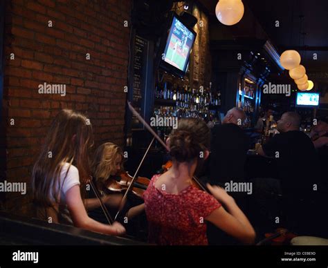 Musicians playing Irish fiddle tunes at Spike Hill Bar, Brooklyn, New ...