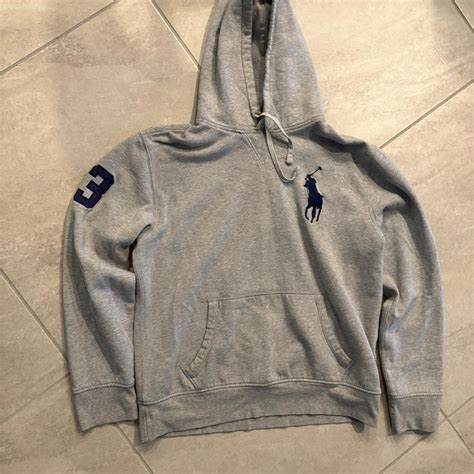 large grey polo hoodie, no noticeable... | Depop
