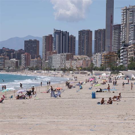 Download Stunning Spanish Beach at Sunset Wallpaper | Wallpapers.com