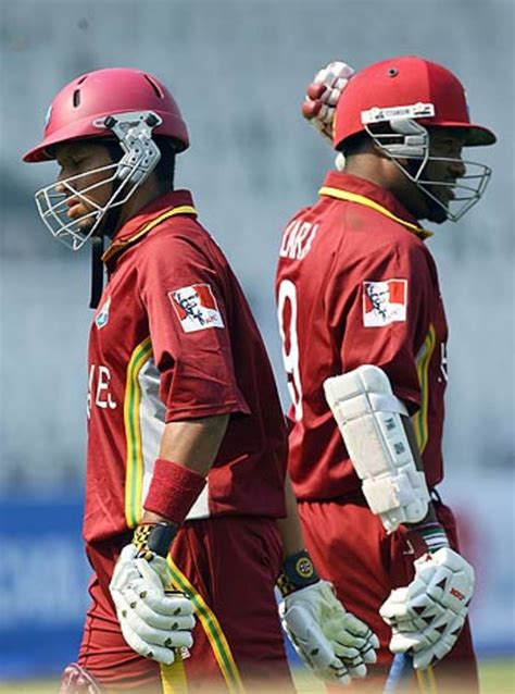 Ramnaresh Sarwan and Brian Lara cross each other as Sarwan returns to the pavillion and Lara ...