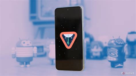 A phone displaying a Google logo is held up to a screen displaying a Wiz logo