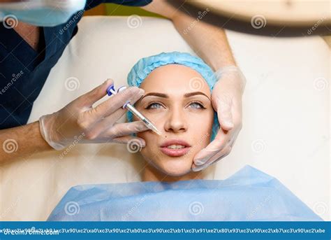 Woman Makes Rejuvenating Facial Injections Procedure for Lips Augmentation. Plastic Surgery in ...